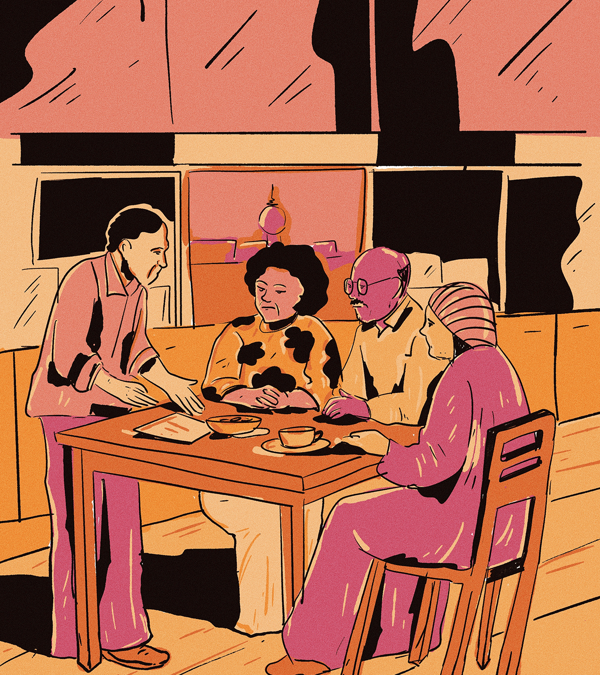 4 Personen reden am einem Tisch.